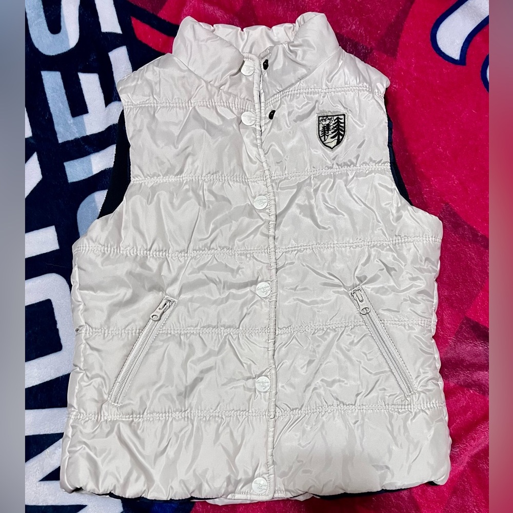 White American Eagle puffer vest w/emblem on the front & navy lining. Like new!